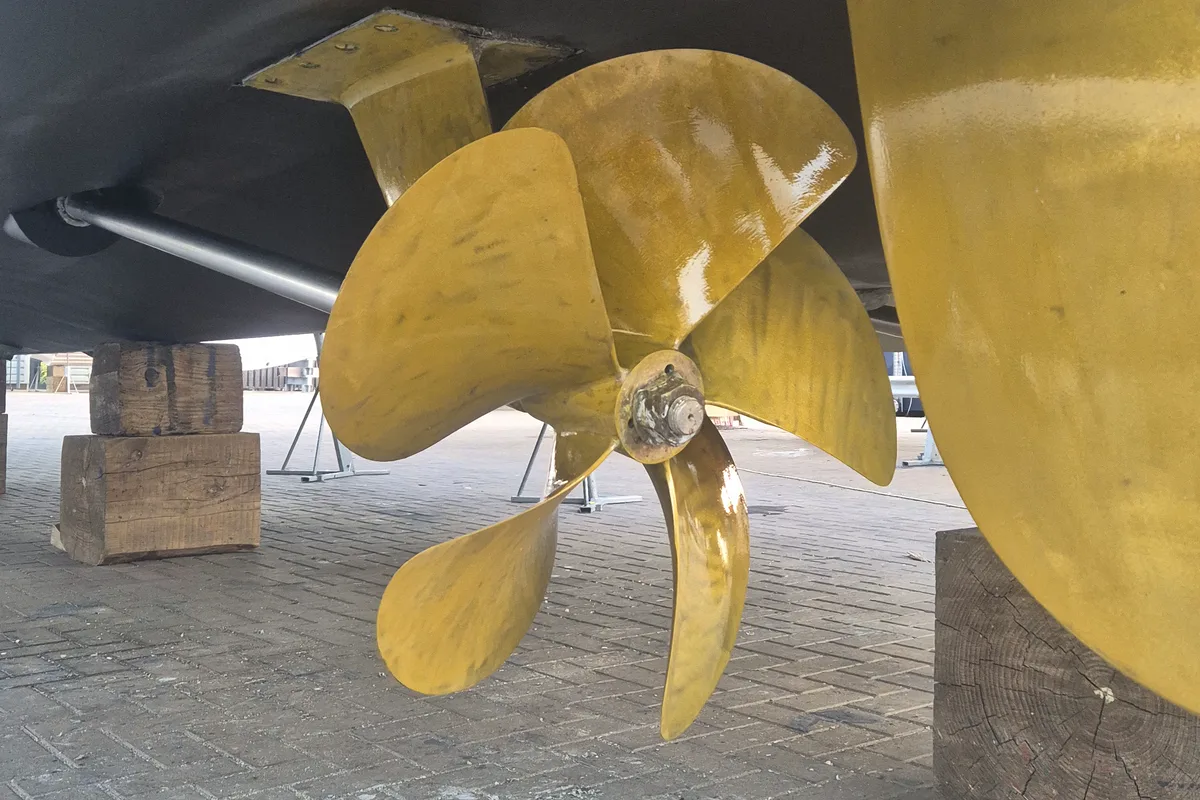 A yacht's propeller and running gear ashore, coated for foul release