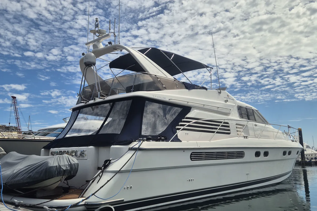A cleaned Fairline motor yacht on its berth after a routine washdown and valet